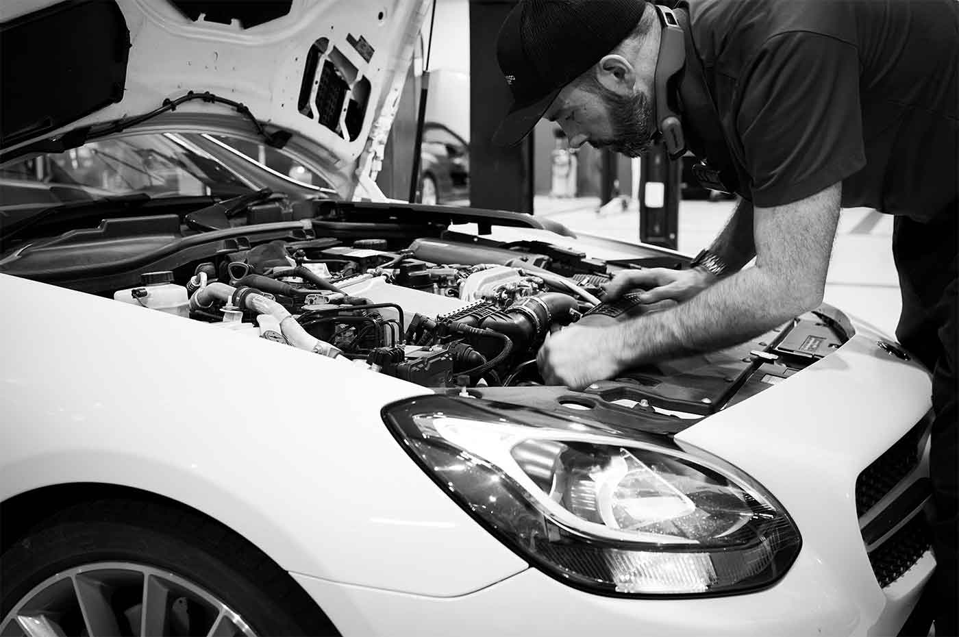 Professional technician working on vehicle